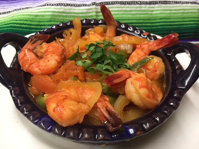 Camarones a la mexicana in a clay bowl